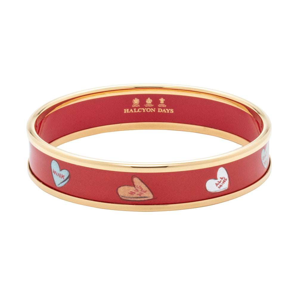 Women's enamel bangle in red with love heart illustrations and gold rims